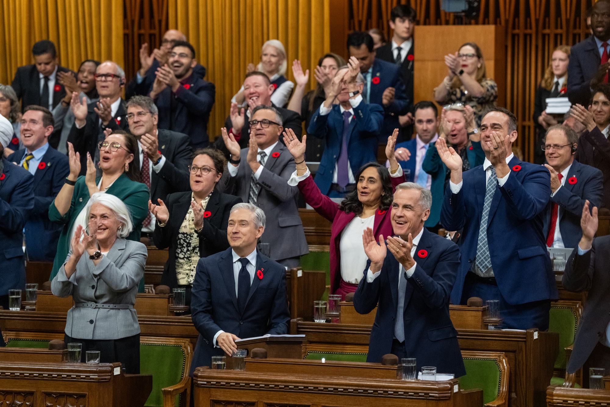Liberal Members of Parliament standing in the House of Commons